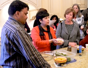 Chefs Hemant Mathur and Surbhi Sahni (in red) demonstrate the recipe.